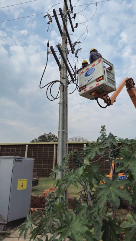 The grid crew tying the site into the medium-voltage line.