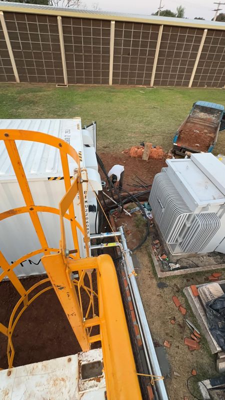From the container roof: transformer, trench, perimeter wall.